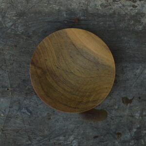 An aerial view of a small, hand-turned reclaimed magnolia wood dish for rings or condiments finished with food-safe oil