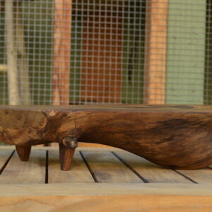 A side view of the grain of a live-edge magnolia charcuterie board finished with food-safe oils for non-toxic living